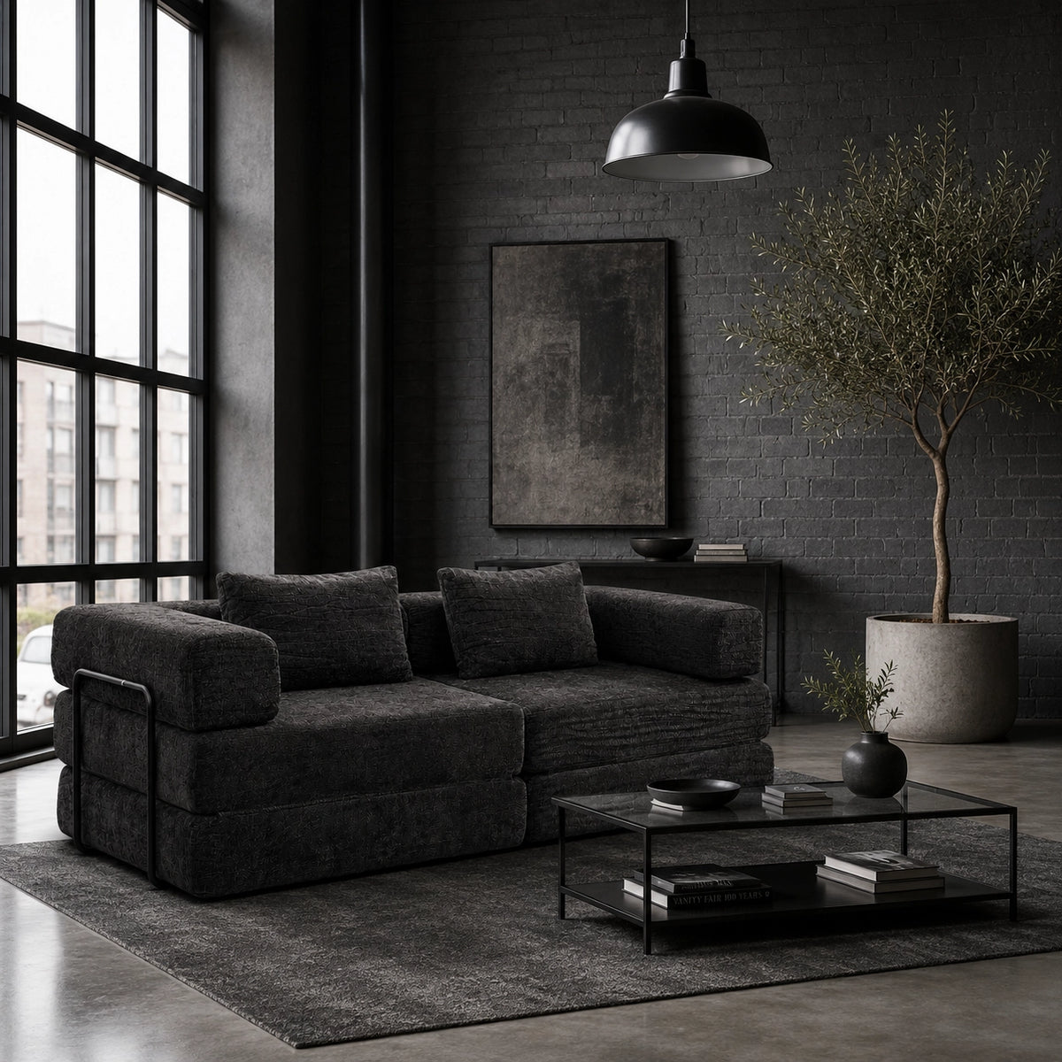Canapé-lit modulable Kovena Duo gris anthracite dans un intérieur décoré