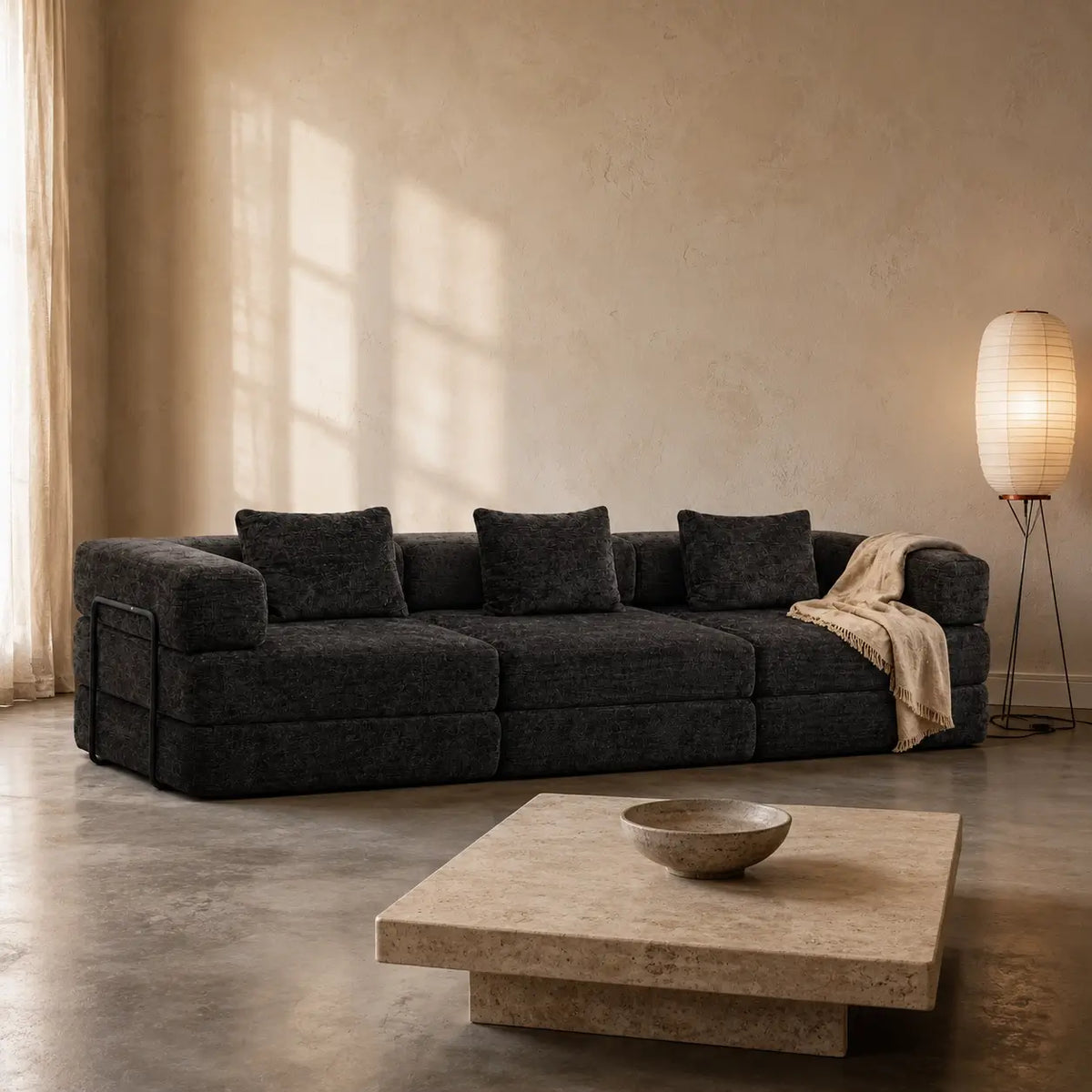Canapé-lit modulable Kovena Trio gris anthracite dans un intérieur décoré
